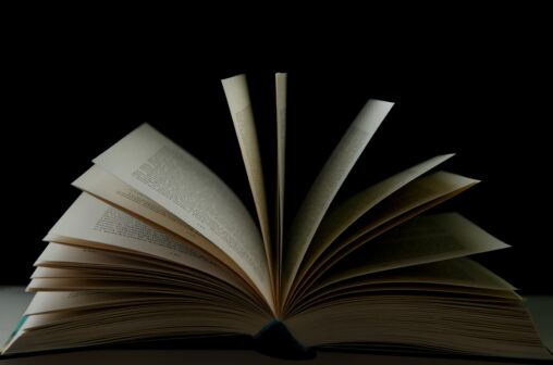 Photo of a book with pages fanned.
